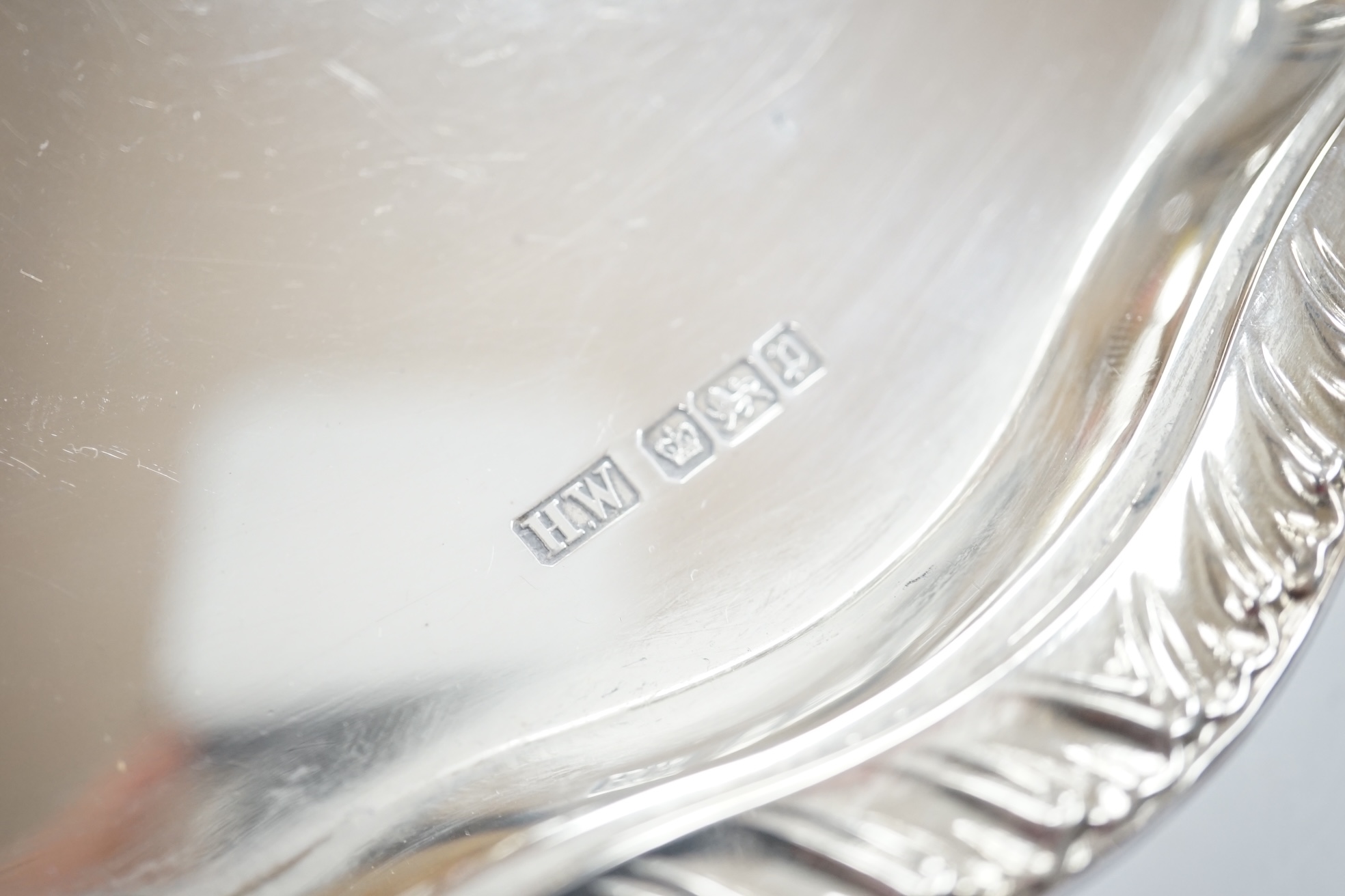 An Edwardian silver salver, with later engraved inscription, on three claw feet, Henry Wigful, Sheffield, 1907, 32.3cm, 27.9oz. Condition - fair to good